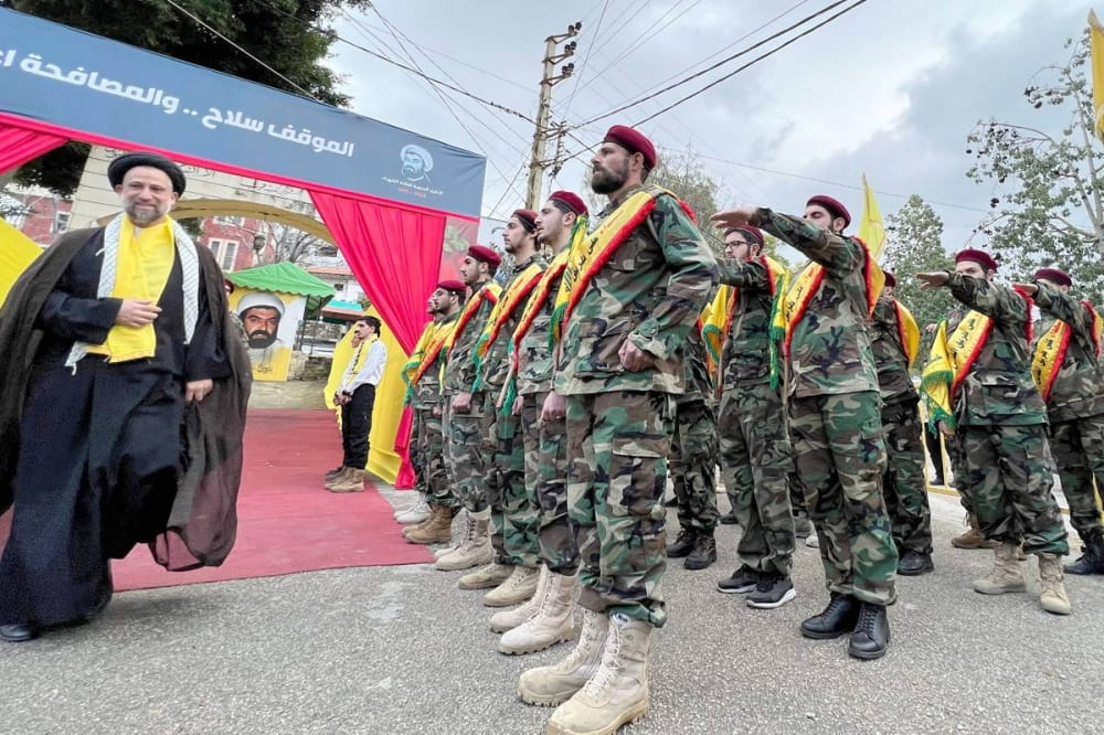 ئەندامانی حیزبوڵڵا لە پرسەی یەکێک لە ئەندامە کوژراوەکانیان - وێنە: AFP